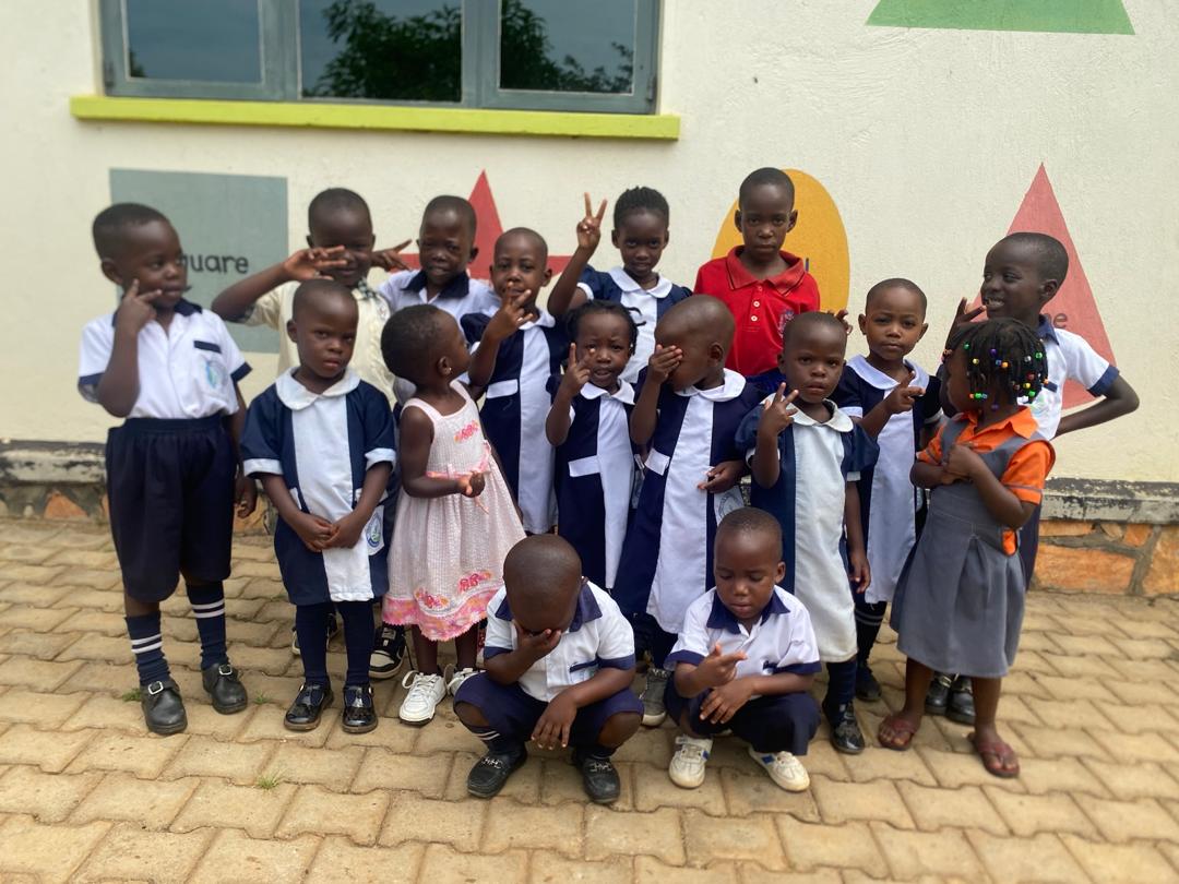 Happy school children learning in classroom
